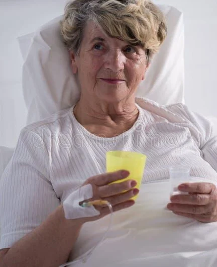 f39c41bb-2884-4e7b-8090-89422cabd3cc-woman-taking-pills-ill-older-women-hospital-56806324.jpg
